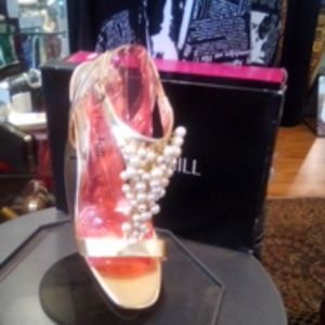Metallic gold with pearls. 4 1/2 inch heel